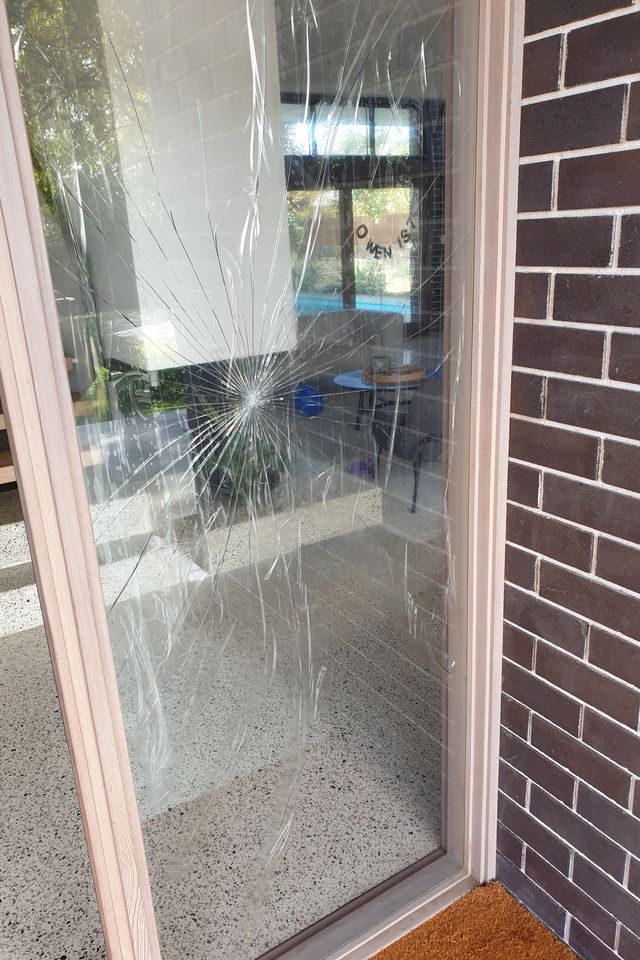 Shattered entry glass panel — Ardross, before