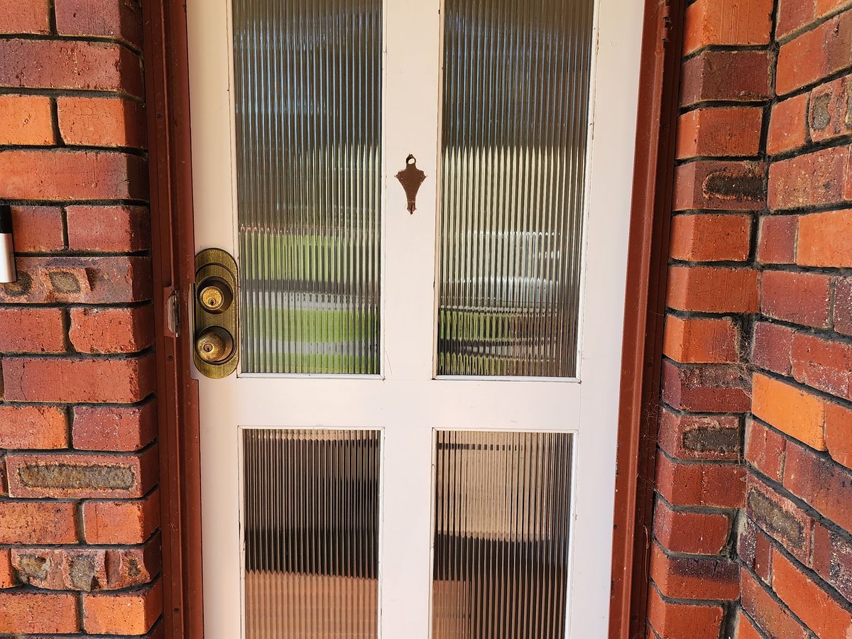 Front door reglazed with reeded glass — Greenwood, after