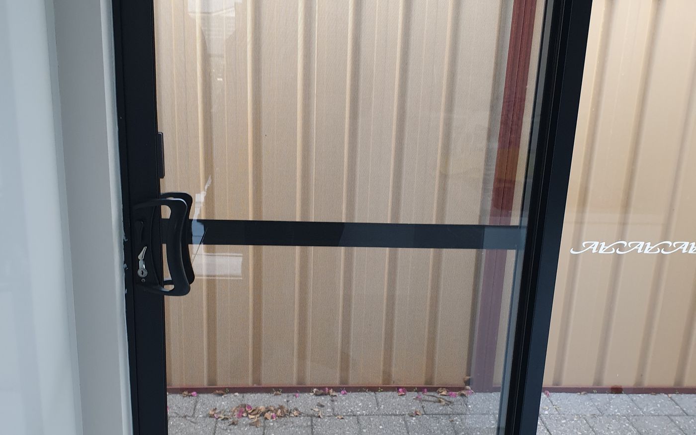 Sliding door with new glass installed — Morley, after