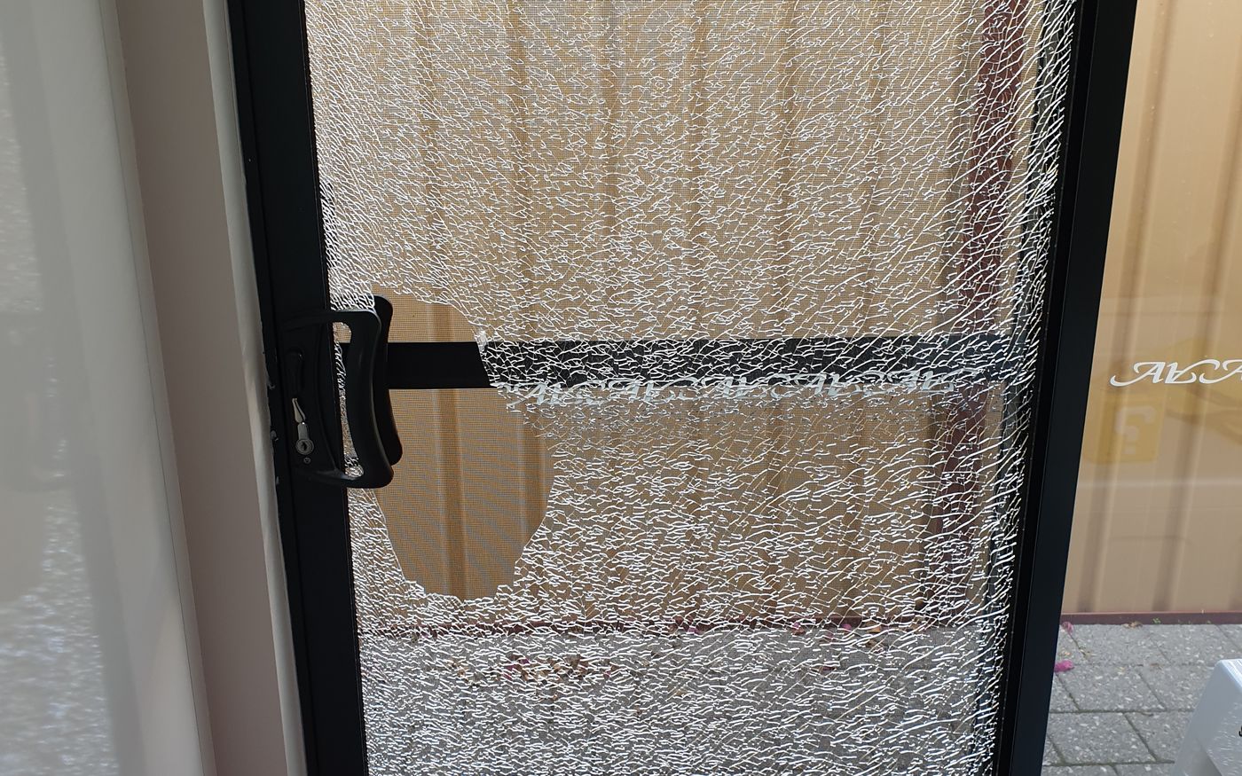 Shattered sliding door glass — Morley, before