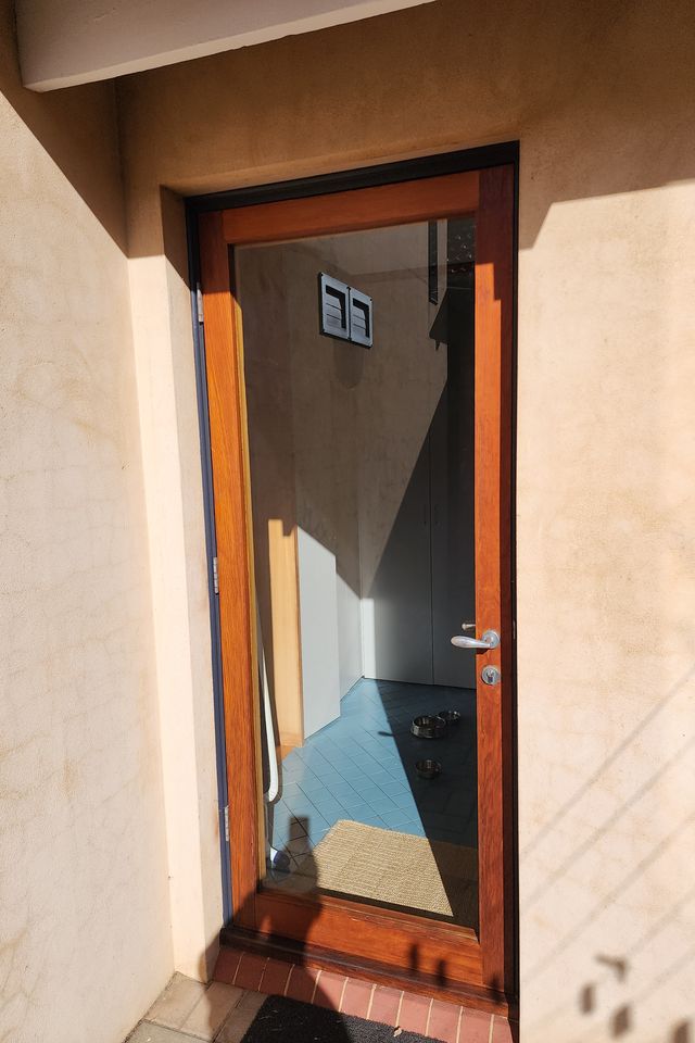 Full-glass door with new pane installed — Nedlands, after