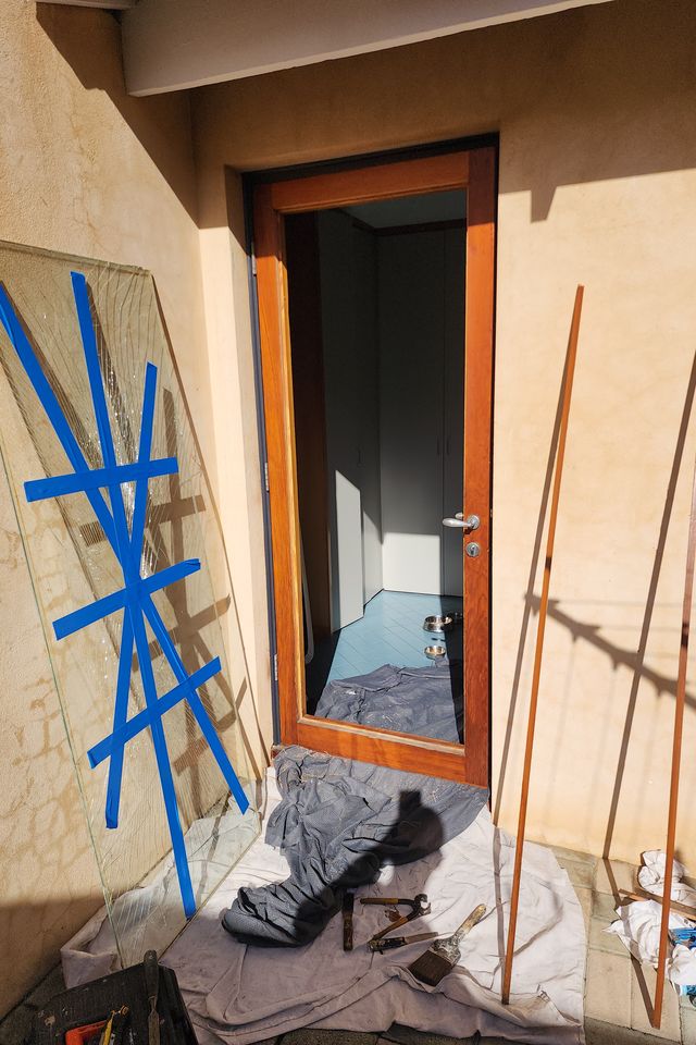 Broken door pane removed and taped, ready for reglazing — Nedlands, before